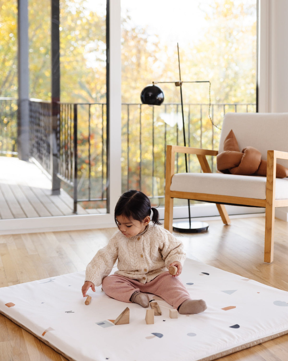 child playing on play mat