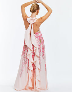 Pink evening halter  gown with cascading bow in rear. Dripping pink wisteria print on front. 