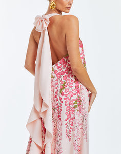 Pink evening halter  gown with cascading bow in rear. Dripping pink wisteria print on front. 