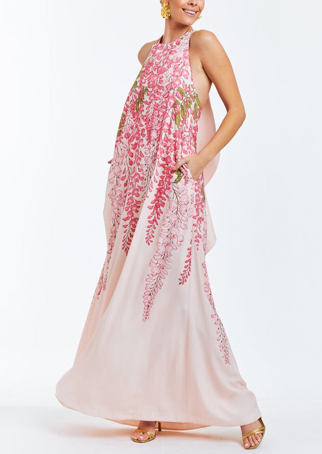 Pink evening halter  gown with cascading bow in rear. Dripping pink wisteria print on front. 