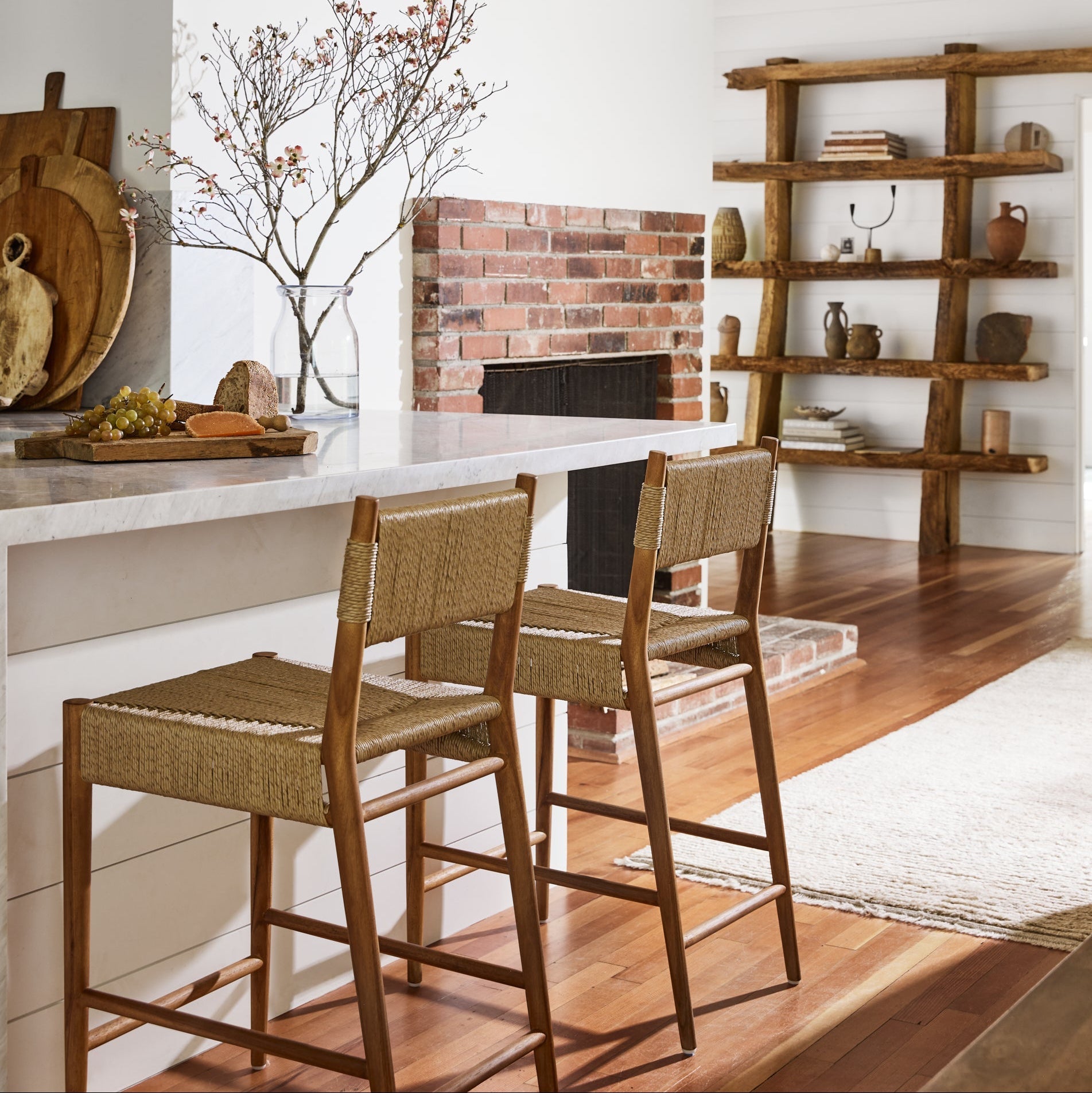 counter stools in kitchen with white walls