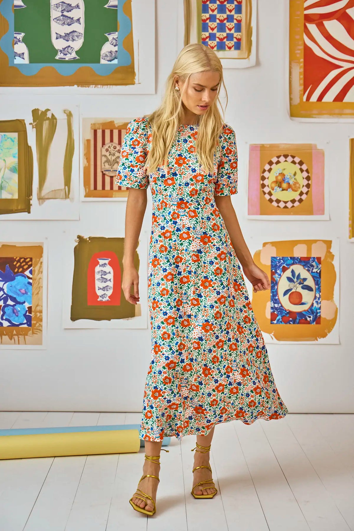 The Casey Dress is a sheath midi dress with a curved waist seam and a relaxed skirt.