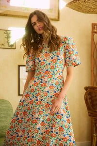The Casey Dress is a sheath midi dress with a curved waist seam and a relaxed skirt.