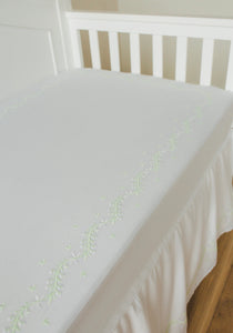 Little English classic nursery goods for baby, white crib sheet with simple light green embroidery along the edges for baby