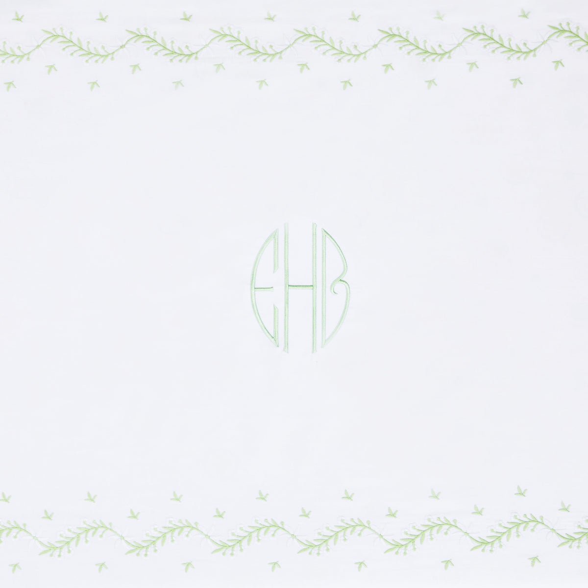 Little English classic nursery goods for baby, white crib sheet with simple light green embroidery along the edges for baby