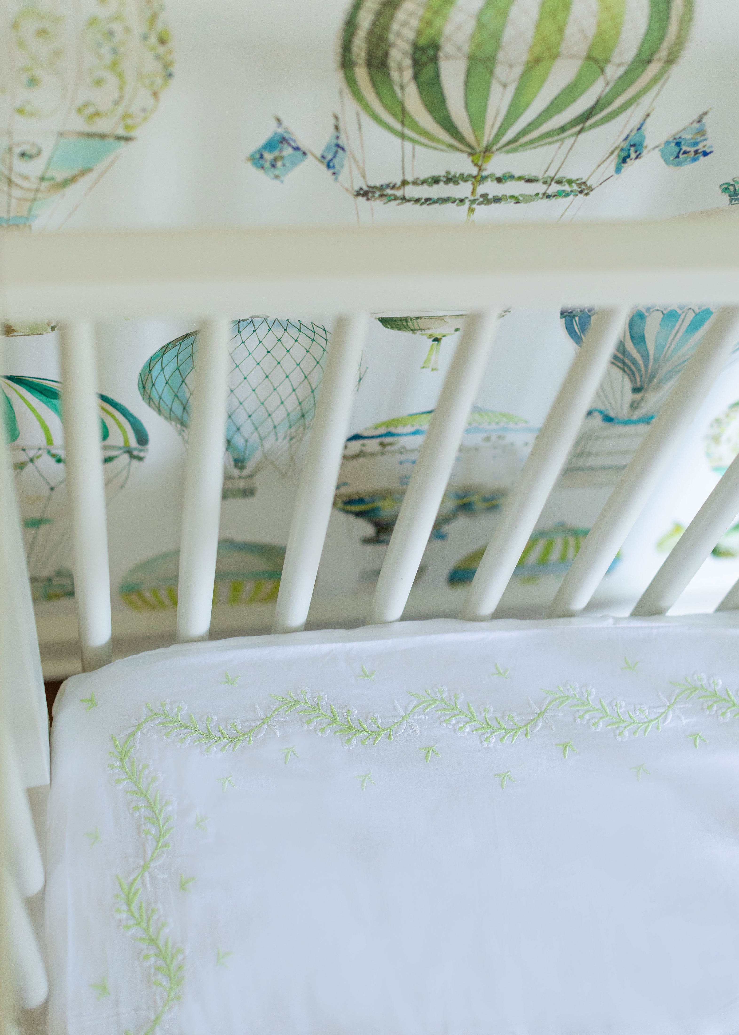 Little English classic nursery goods for baby, white crib sheet with simple light green embroidery along the edges for baby