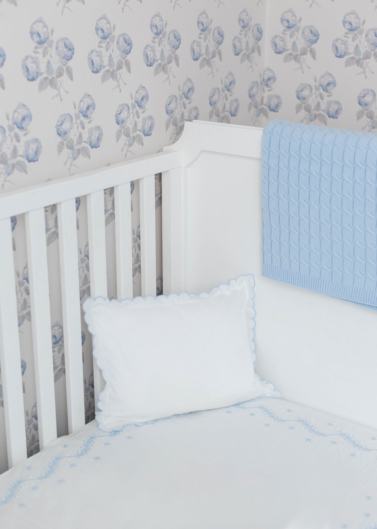 Little English classic nursery goods for baby, white crib sheet with simple light blue embroidery along the edges for baby