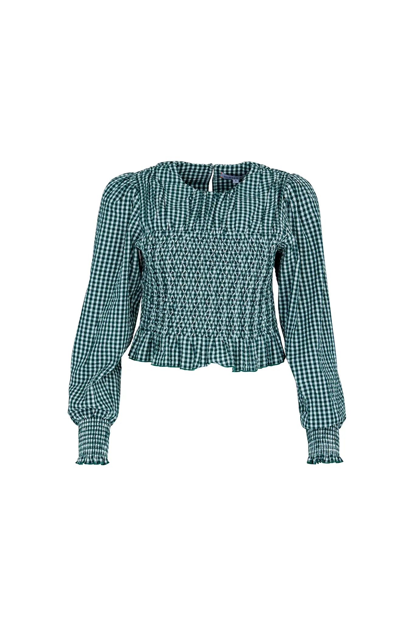The Eubanks Top has a fitted bodice, puff sleeves, smocked cuffs, shirred yoke, and purl edge trim.