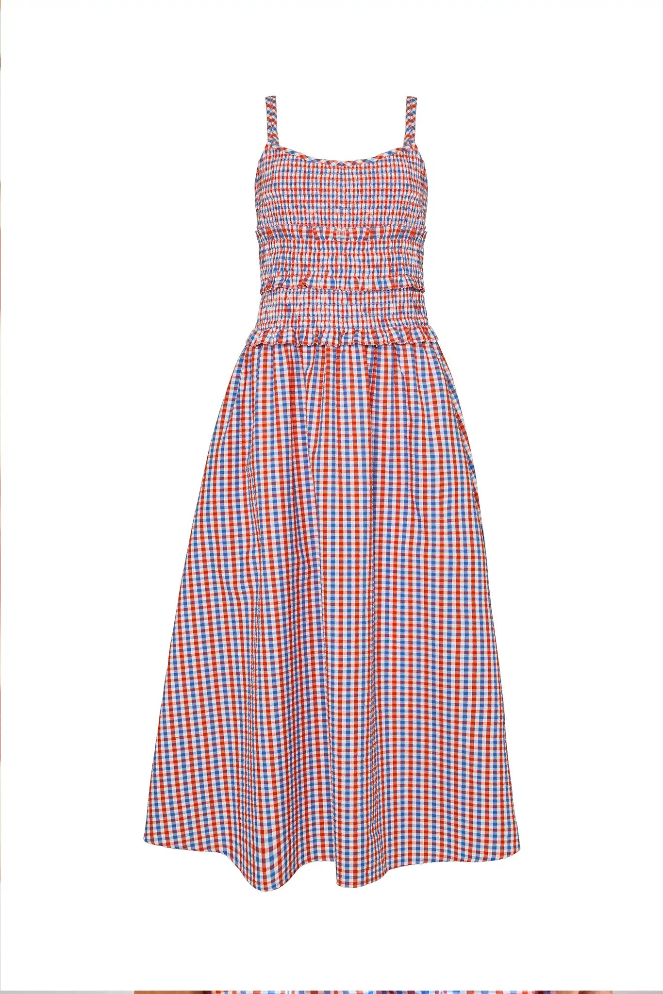 The Francie Dress has a cami neckline, double straps, a smocked bodice and a full, shirred skirt.