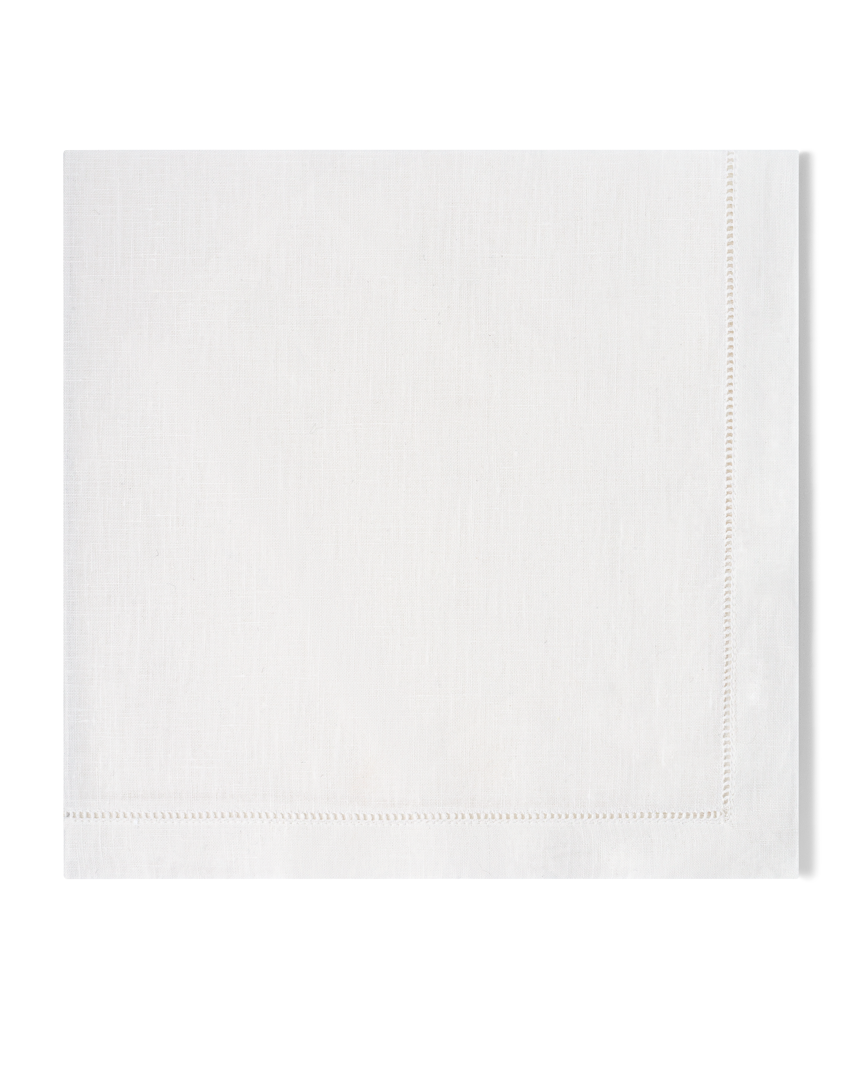 A white linen napkin with a hemstitch border