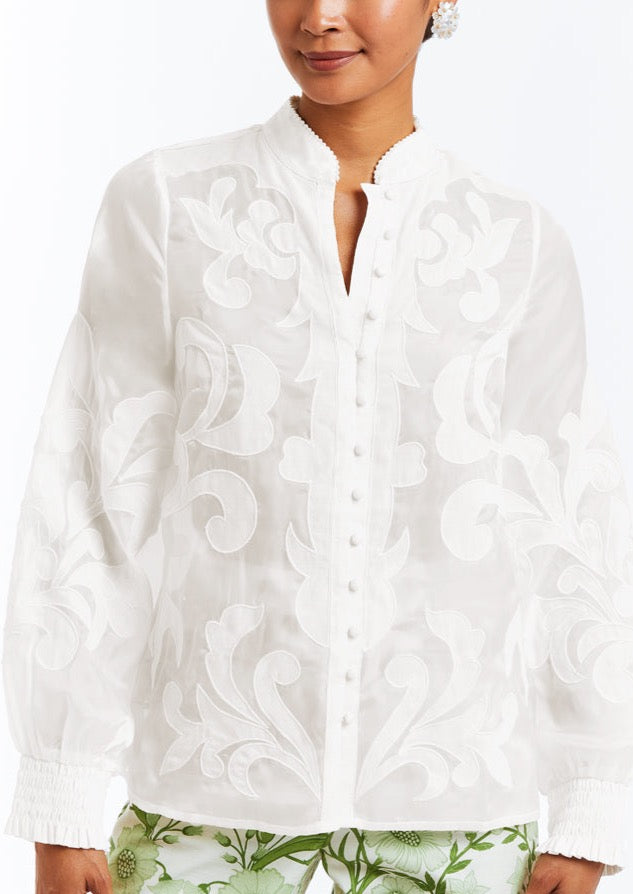 Linen blouse with full length bishop sleeves, functional buttons, and embroidered flourishes. 