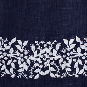 An example of navy linen with white embroidery