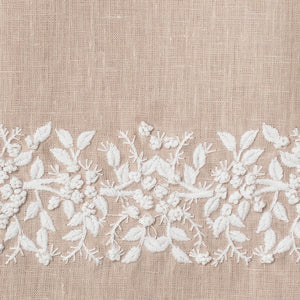 An example of taupe linen with white embroidery