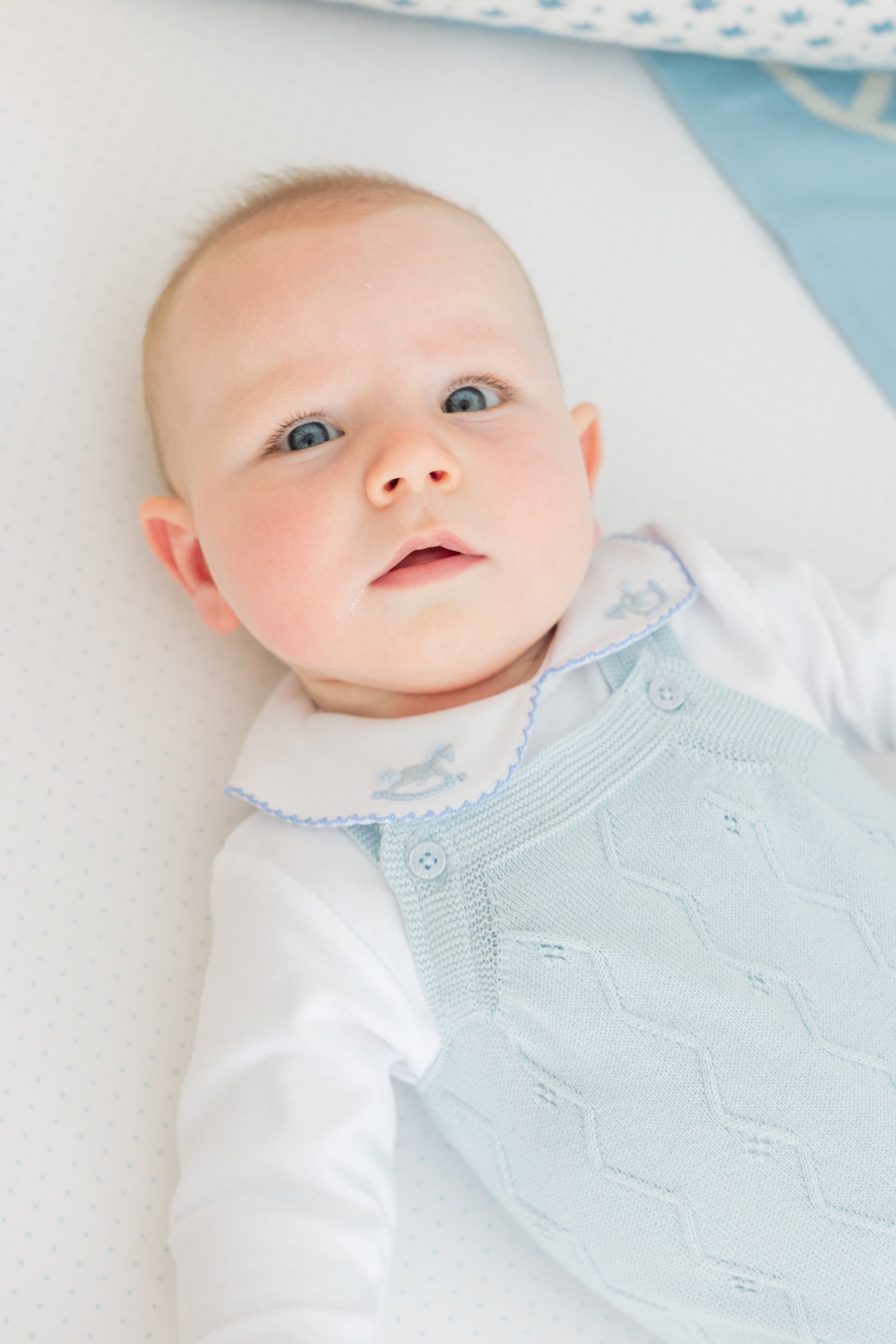 little english classic children's clothing baby boys light blue pointelle knit bubble with pinpoint onesie with rocking horse motif. Pima crib sheet in blue micro dot, for baby boy