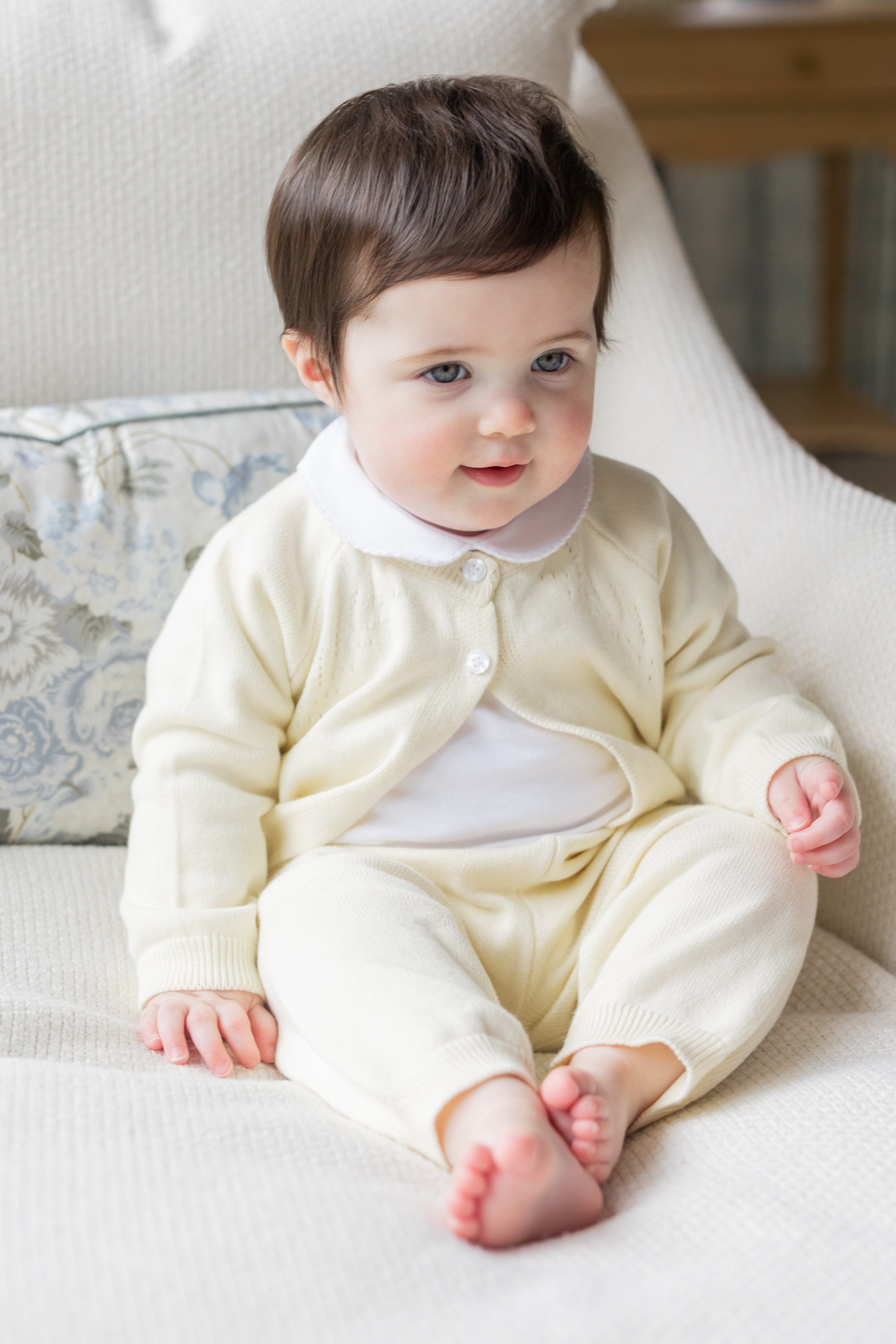 Little English traditional children's clothing. Long sleeve and long pant cream pointelle sweater set accompanied by a picot peter pan onesie in white for baby.