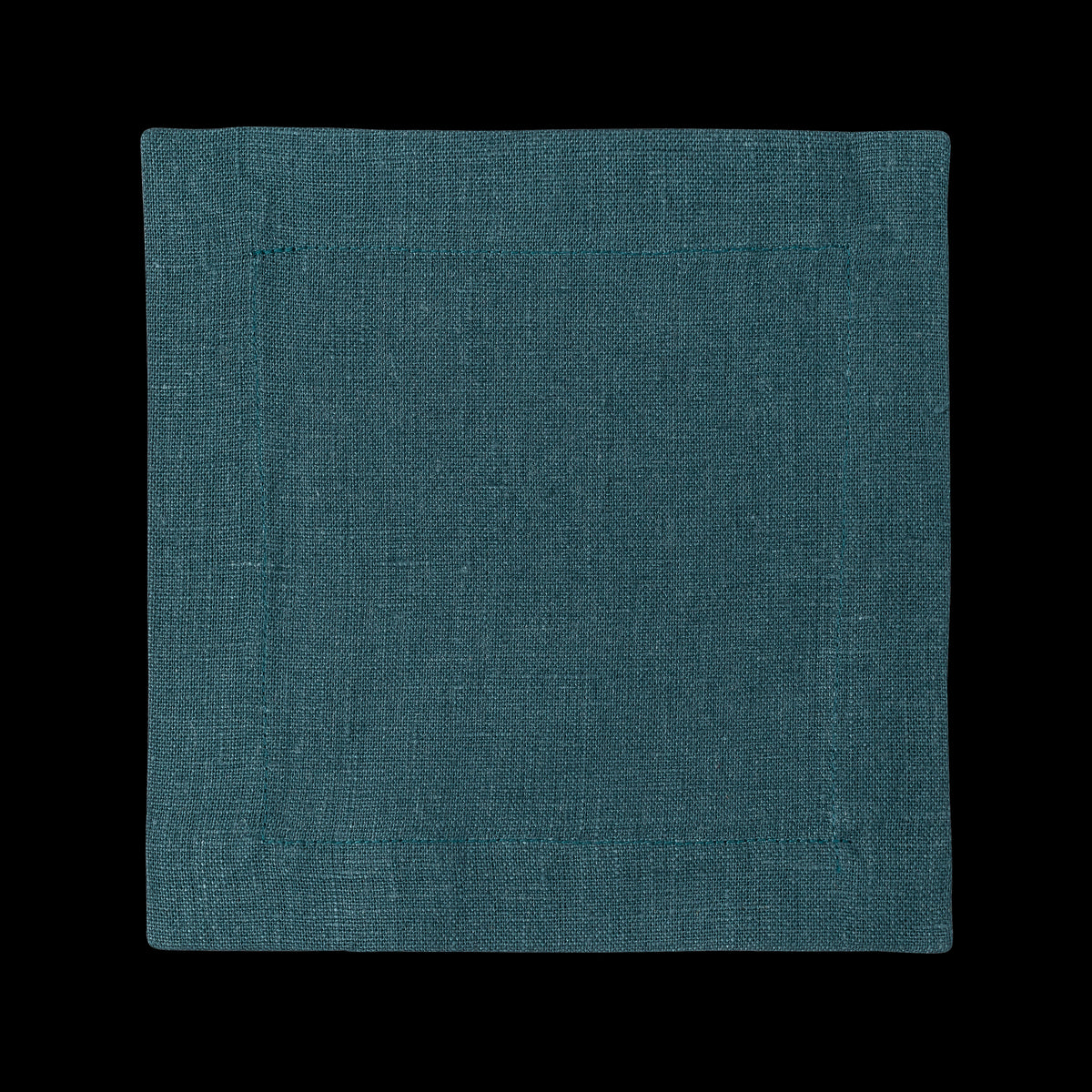 A square linen cocktail napkin in the color peacock