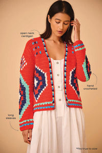 The best-selling Callen cardigan is a hand crocheted knit with long sleeves and an open front.
