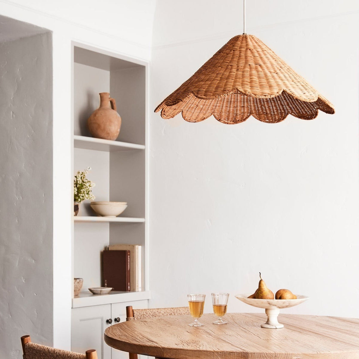 maude rattan scallop pendant over table