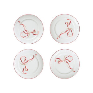 A set of four ribbon dessert plates in pink. HarperÕs Bazaar Best Hostess Gifts for Dinner Parties, Movie Nights, and More. These ribbon-adorned dinner plates can transform even an easy meal into something fit for a downtown It-girl. With three different colors to choose from, you can find the perfect option for home design lovers.