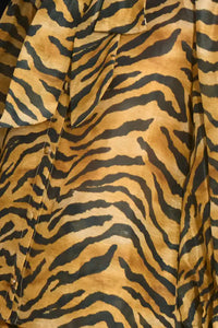 The Tess Blouse in Tiger print, has an elegant tie-front neckline that can be styled into a bow.