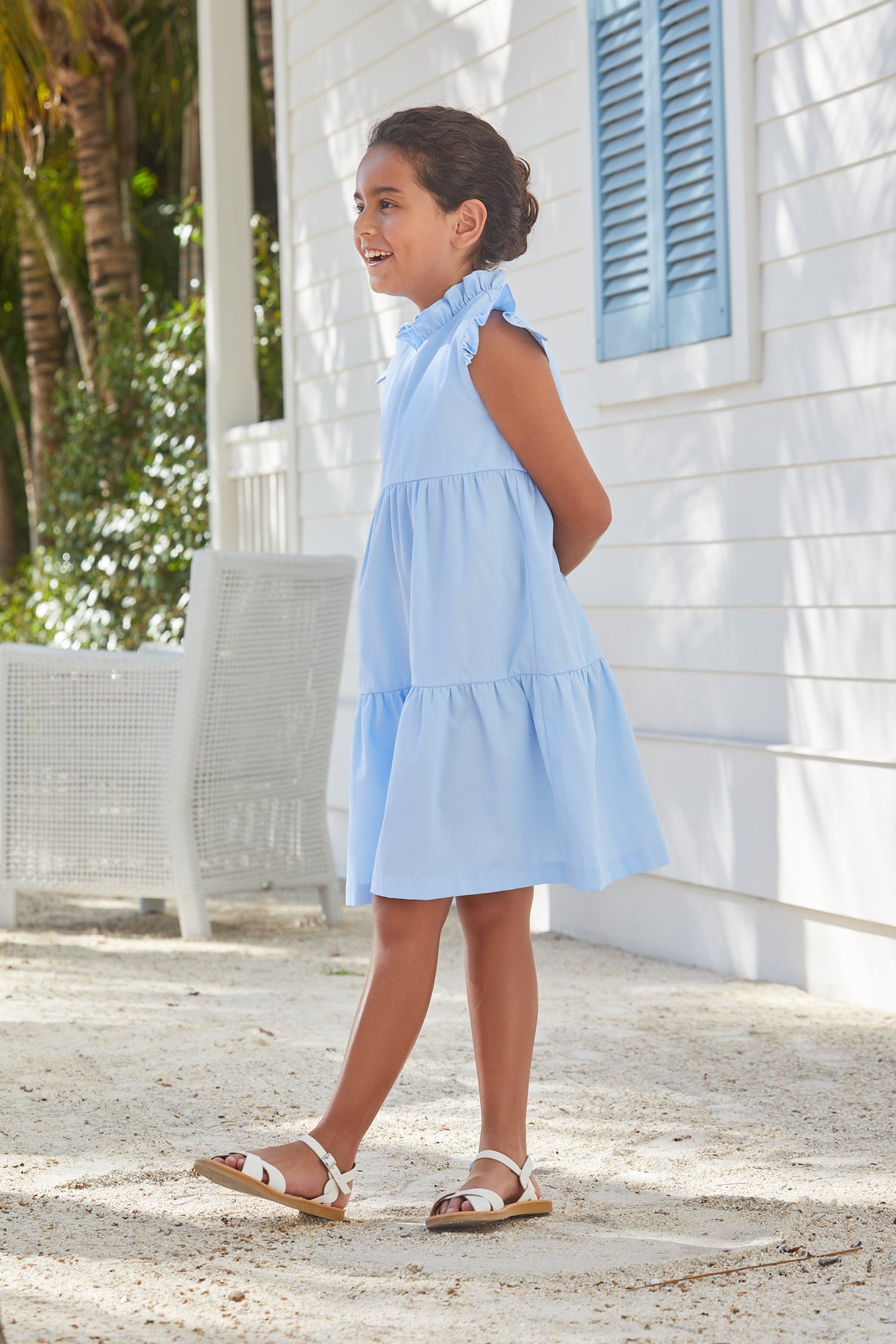 Little English traditional children‚Äôs clothing, girl's light blue tiered dress for Spring with ruffles at the collar and sleeves