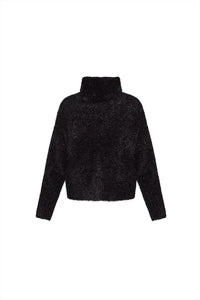 The turtleneck is made with shimmering yarn, oversized, long sleeves, and slightly cropped fit.