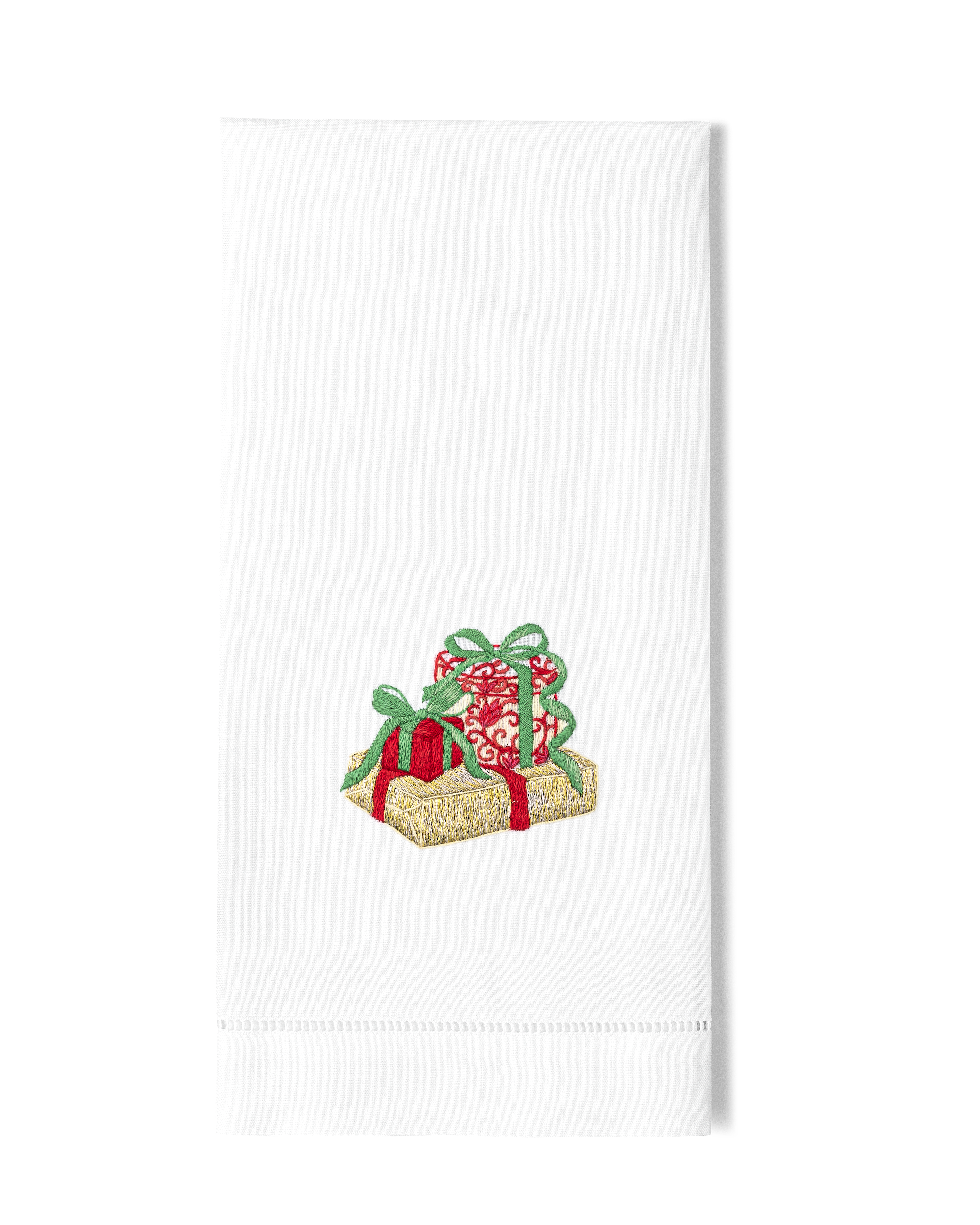 A white hand towel with a hemstitch. A trio of glittering christmas gifts are embroidered in the center