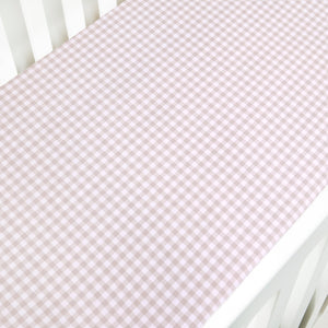 Crib Sheet in Picnic Gingham Print in Beige Color laid on a crib