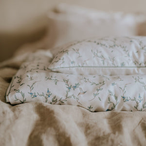 Folded Baby Duvet with Toddler Pillow in the "Secret Garden" print in the ivory color