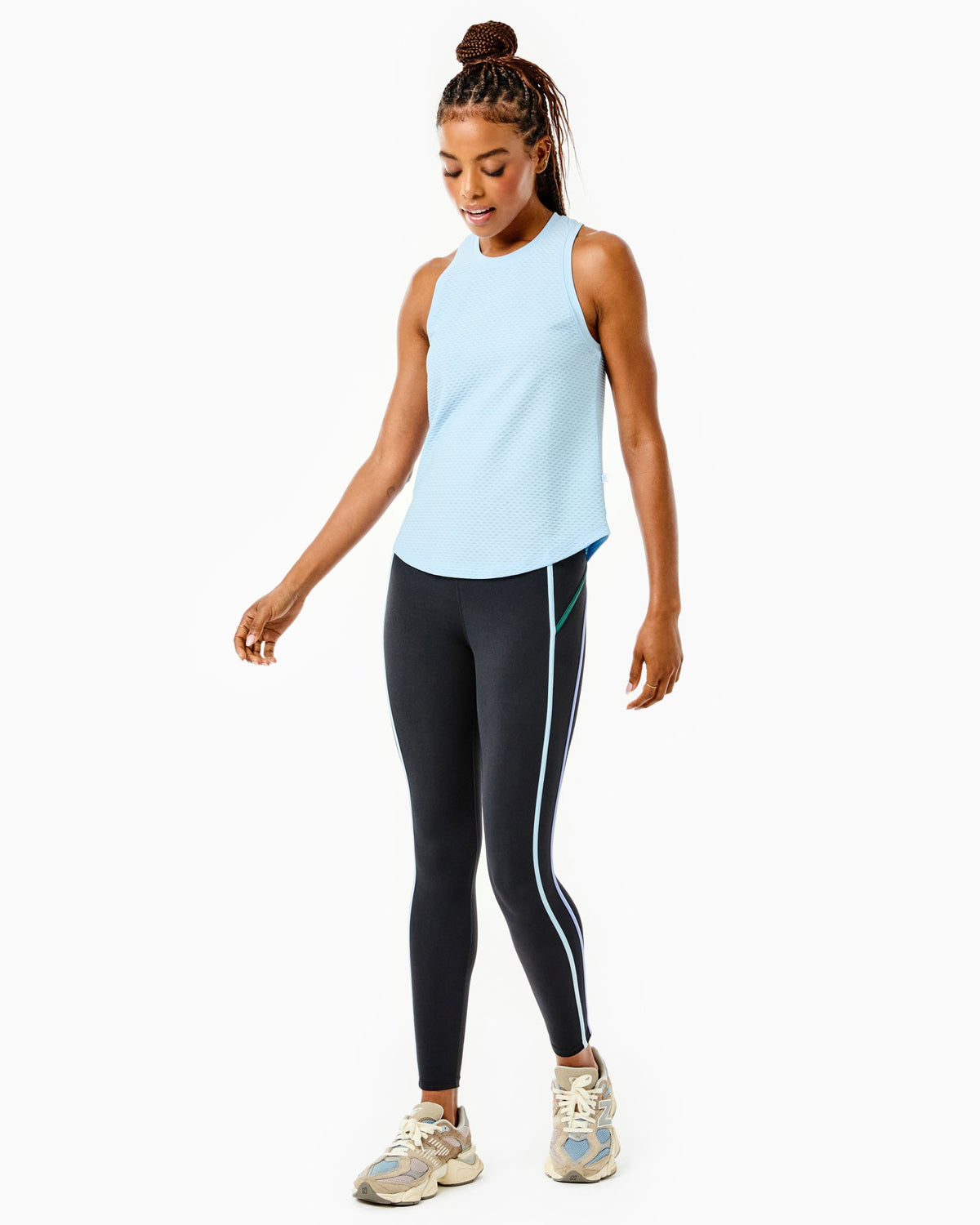 Model is wearing the Everyday Tank in Baby Blue with the Chestnut Legging in Black