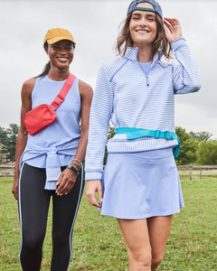 Model is wearing the Everyday Tank in Violet with the Everyday Legging in Ivy/ Violet Stripe