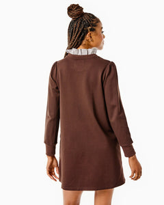 Model is wearing the Hutton Dress in Chocolate.