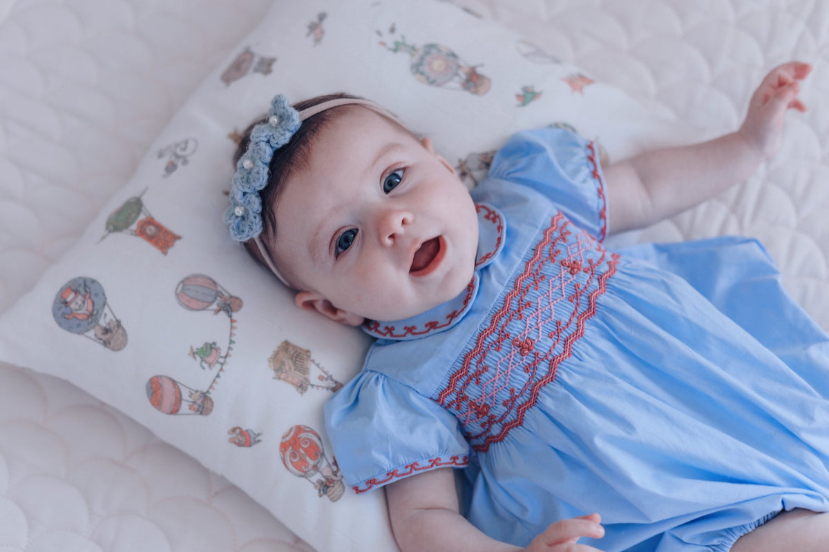 Princess Charlotte Sky Blue Smocked Baby Romper