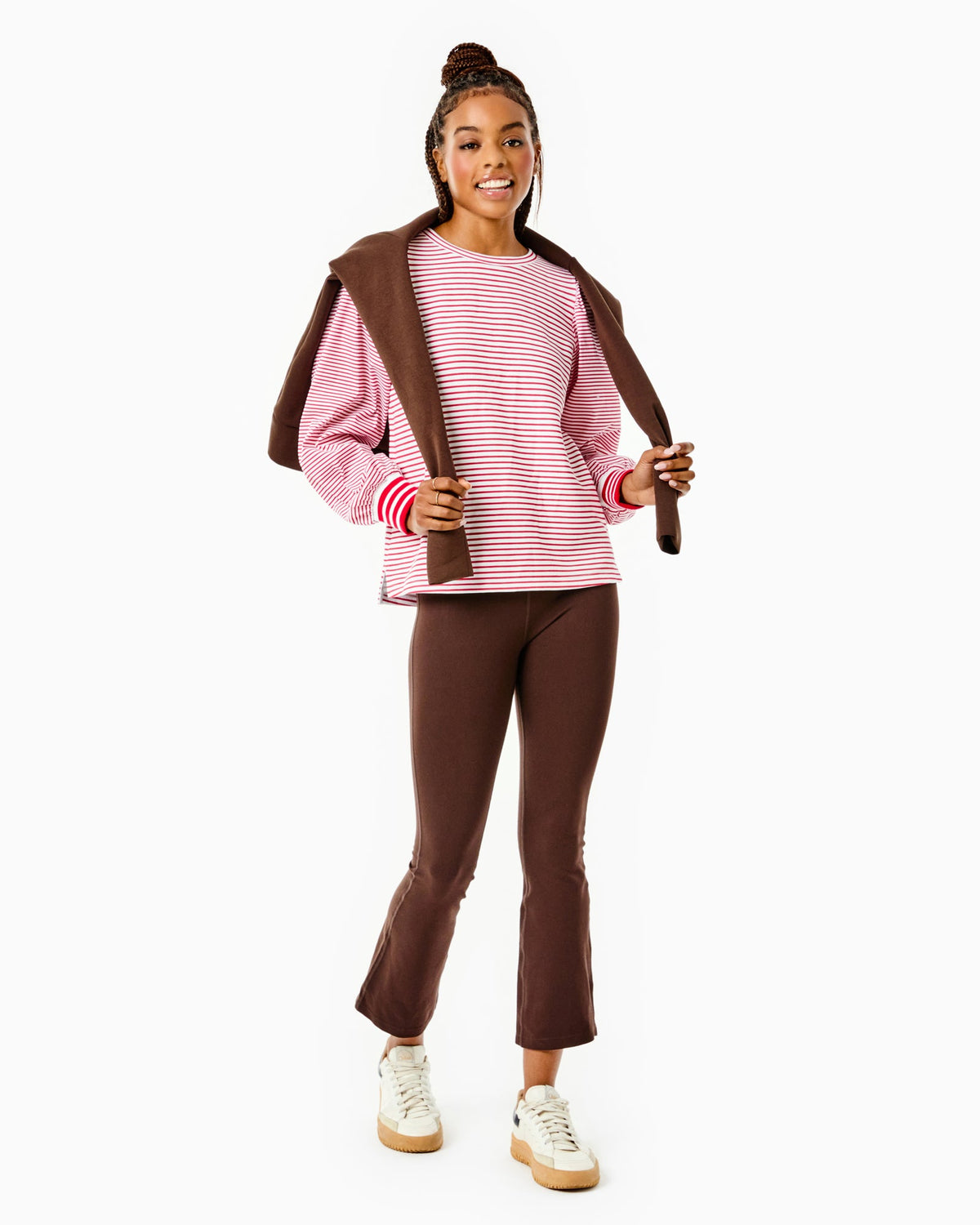 Model is wearing the Penny Pullover in Super White/ Cherry Stripes with the University Flare Pants in Chocolate