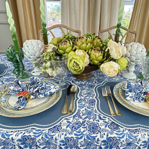 Autumn blue placemat with white embroidery, blue floral napkin and tablecloth and leaf napkin ring