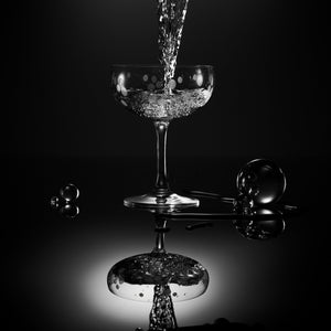 A Chatham Pop etched coupe cocktail glass by Caskata with glass marbles.