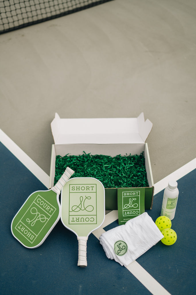 The perfect gift box, Mother's Day, Father's Day, birthdays. Bundle box of all Pickleball essentials. Pickleball paddles, water bottles, courtside towel. Pickleball package!