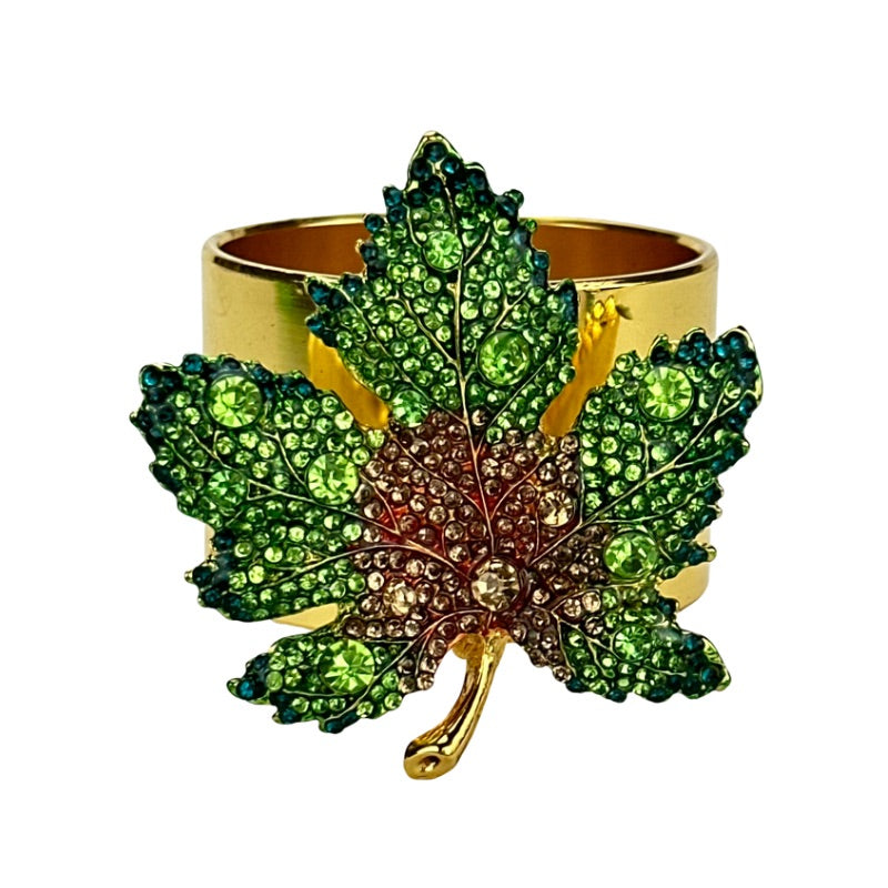 Brass napkin ring with green jeweled leaf