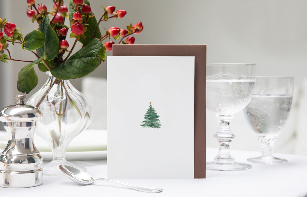 Luxury Christmas Card by Memo Press with a watercolour illustration of a traditional Christmas Tree with a single star on top and comes with a nubuck brown envelope made in Britain