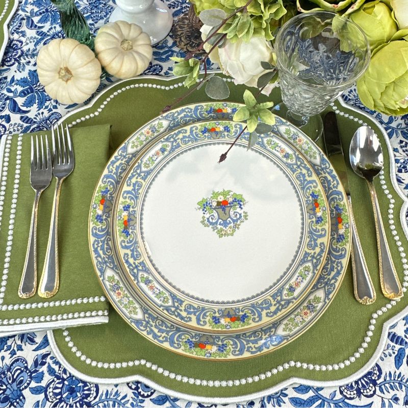 Sage placemat with white embroidery and matching napkin