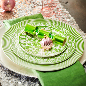 A holiday table with a premium porcelain Green Newport Garden Gate canapé, salad plate and a Newport Stripe dinner plate from Caskata.