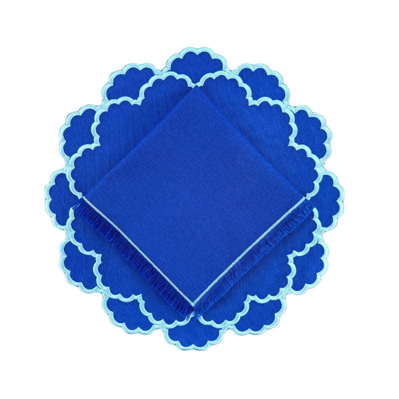 Blue placemat with light blue embroidery