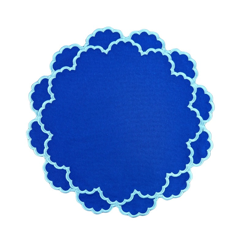 Blue placemat with light blue embroidery